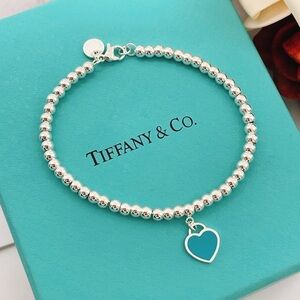 Tiffany & Co. Silver Beaded Bracelet with Blue Heart Charm